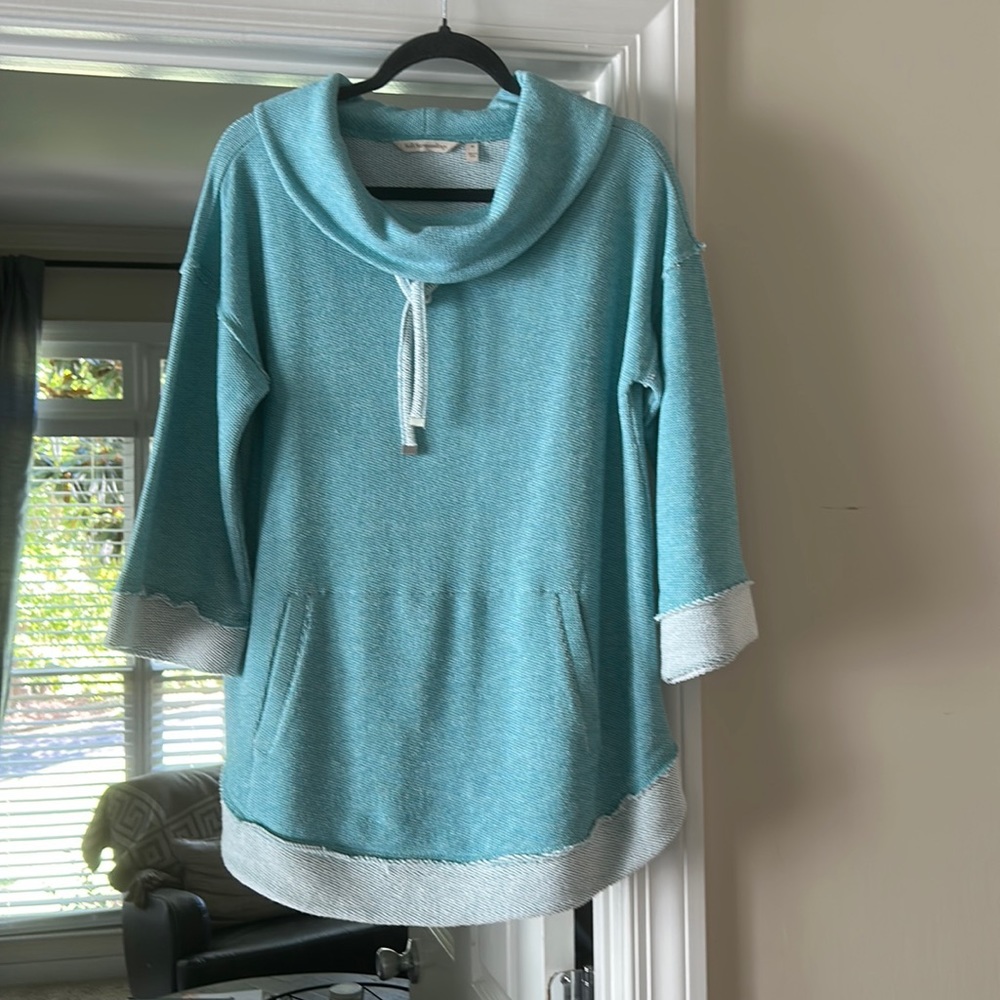 Light weight sweater. Pockets in front. 74 percent cotton.